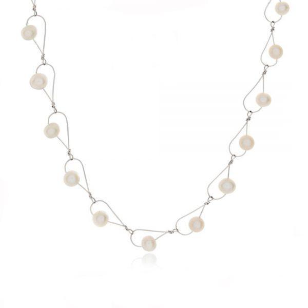 This chain necklace with pearls has been made by combining tear drop shaped links made from white freshwater pearls strung through sterling silver wire. These links are connected to form this pearl, chain link necklace.