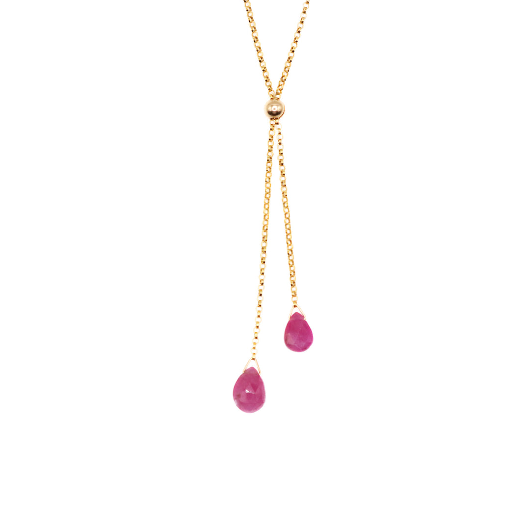 This dainty ruby necklace has been made from 14K gold fill and ruby gemstones. The chain is dainty and there are two lariats that hang below the necklace with teardrop shaped gemstone attached at the bottom.