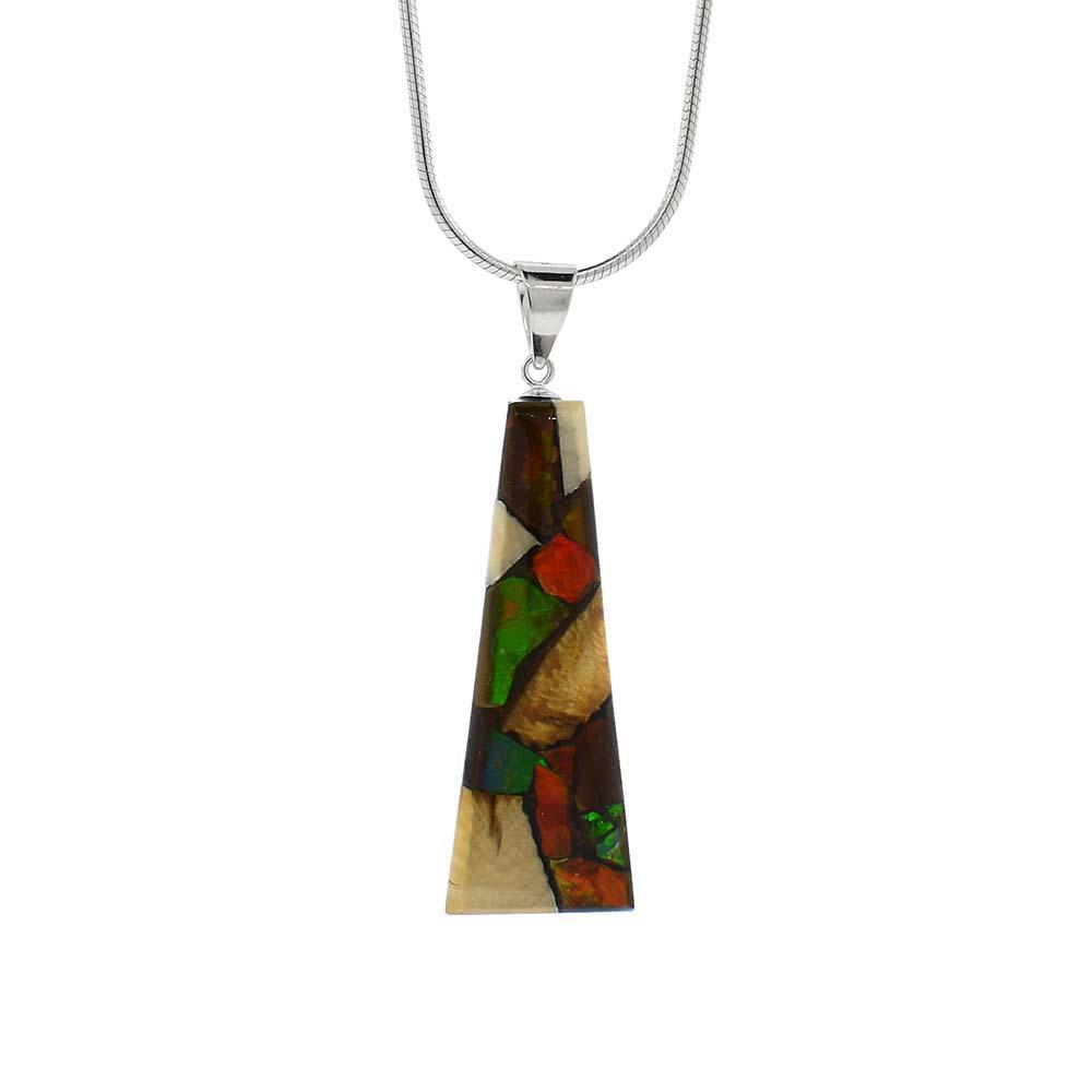 This unique ivory pendant is made from fossilized mammoth ivory, ammolite gemstone and sterling silver. The pendant is short, tapered, and wide and is made from casting the ivory and ammolite into the shape. The jump ring is made from sterling silver.