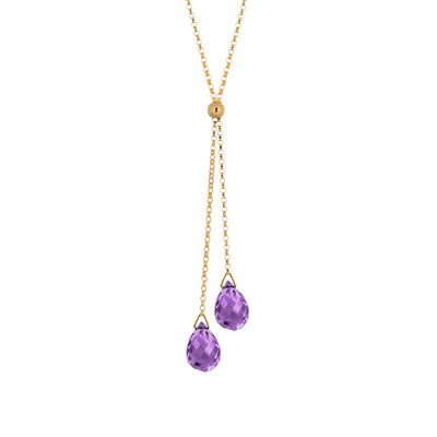 This Gold Fill Amethyst Lantern Lariat Necklace is hand crafted by artist Pamela Lauz. The necklace is made with a 14k gold-filled chain and two genuine amethyst drops hanging down. The necklace is 17" long and the lariat drops an additional 2.25" down. 
