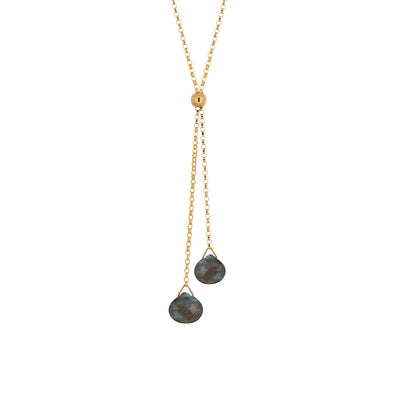 This Gold Fill Labradorite Lariat Necklace is hand crafted by artist Pamela Lauz. The necklace is made with a 14k gold-filled chain and two labradorite drops hanging down. The necklace is 17" long and the lariat drops down an additional 2.25".