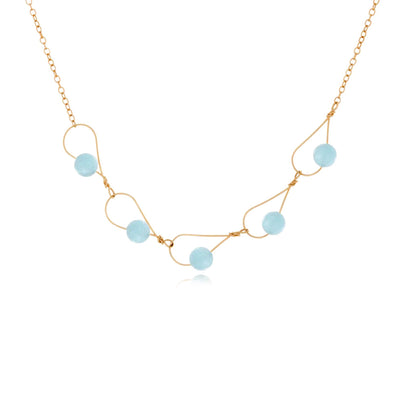 This Gold Fill Rain Drop Collection Aquamarine Necklace is hand crafted by artist Pamela Lauz. She has used genuine aquamarines along with 14k gold-filled chain and wire to create this piece.  The necklace can be worn at 16" or 18".