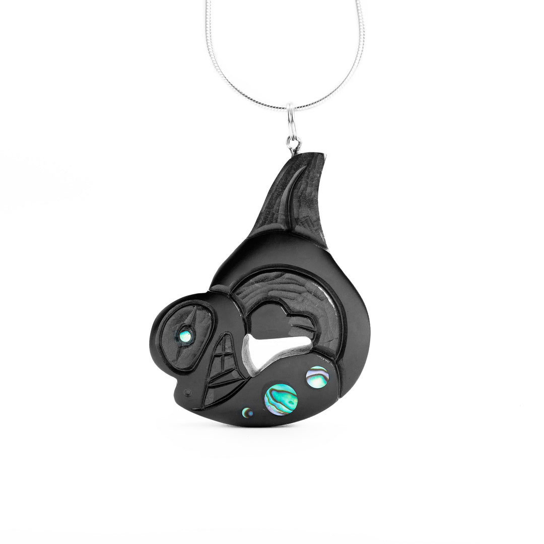 Argillite Breaching Orca Pendant (facing the left) hand carved by Haida artist, Amy Edgars.