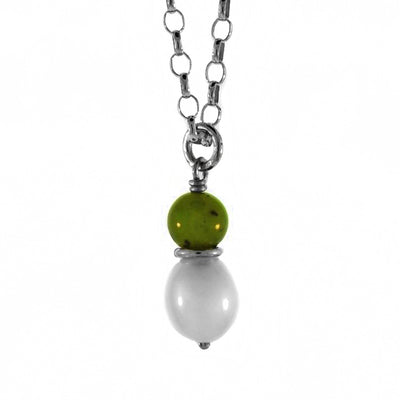 This delicate pendant was created by BC artist Karley Smith. The BC Jade bead rests atop a silver ring above a white freshwater pearl.  The pendant is 0.75" (2cm) tall and the chain is 22″ long.