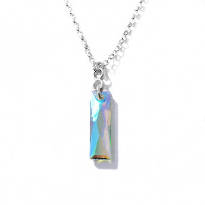 This Rectangular Crystal Necklace is by artist Karley Smith. She has used sterling silver and Swarovski crystal to make this piece.  The pendant measures 1.50" x 0.25" and the chain is 24" long.