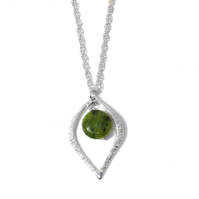 This Bc Jade Sterling Silver Eye Pendant is handcrafted by artist Karley Smith. She has used BC jade and sterling silver to create the pendant. The sterling silver chain is included.  The pendant measures 1.25" x 1" and the chain is 16" long with a 2.5" extender.