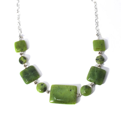 This Delicate Different Shapes BC Jade Necklace is handcrafted by artist Karley Smith. She has used sterling silver and BC jade to create this piece.  The necklace is 18" long and the central rectangle of BC jade measures 0.70" x 0.95".