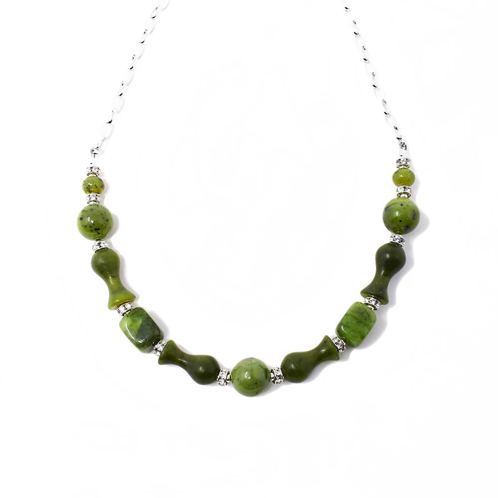 This BC Jade Mixed Shape Necklace is handcrafted by artist Karley Smith. She has used sterling silver, Swarovski crystal, and BC jade to create this piece.  The necklace is 18" long.