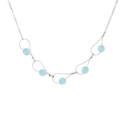 This Sterling Silver Rain Drop Collection Aquamarine Necklace is hand crafted by artist Pamela Lauz. The necklace is made using genuine aquamarine and sterling silver.  The necklace is 16" long with a 2" extension.