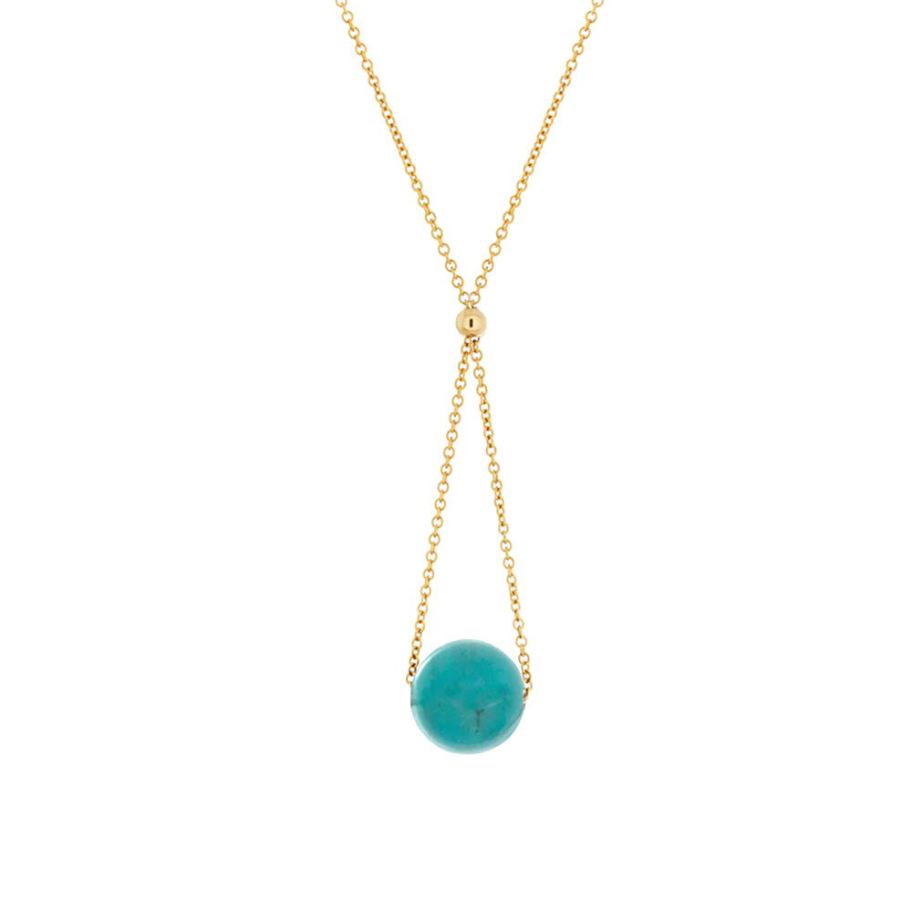 This turquoise pendant necklace has a dainty 14K gold filled chain with a lariat hanging below the piece. The chain runs through the gem bead and gives it a chandelier appearance.