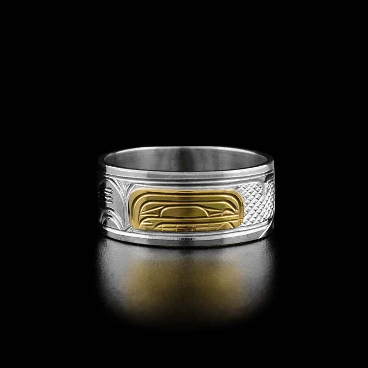 14K Gold and Sterling Silver 3/8" Orca ring by Victoria Harper. The design depicts the profile of an orca's head made from 14k gold facing the right. On both sides of the orca's head the artist has hand carved intricate designs representing the orca's fin and tail using sterling silver.
