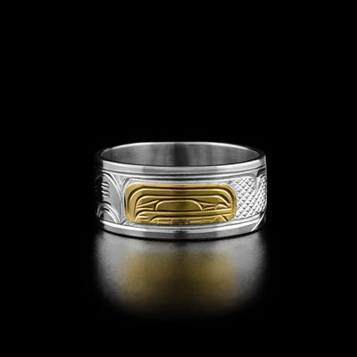 14K Gold and Sterling Silver 3/8" Orca Ring by Victoria Harper. The design depicts the profile of an orca's head made from 14k gold facing the right. On both sides of the orca's head the artist has hand carved intricate designs representing the orca's fin and tail using sterling silver.