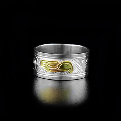 14K Gold and Sterling Silver 3/8" Eagle Ring by Victoria Harper. The design depicts the profile of an eagle's head made out of 14k gold facing the right in the center of the ring. On both sides of the eagle's head the artist has hand carved intricate designs using sterling silver.