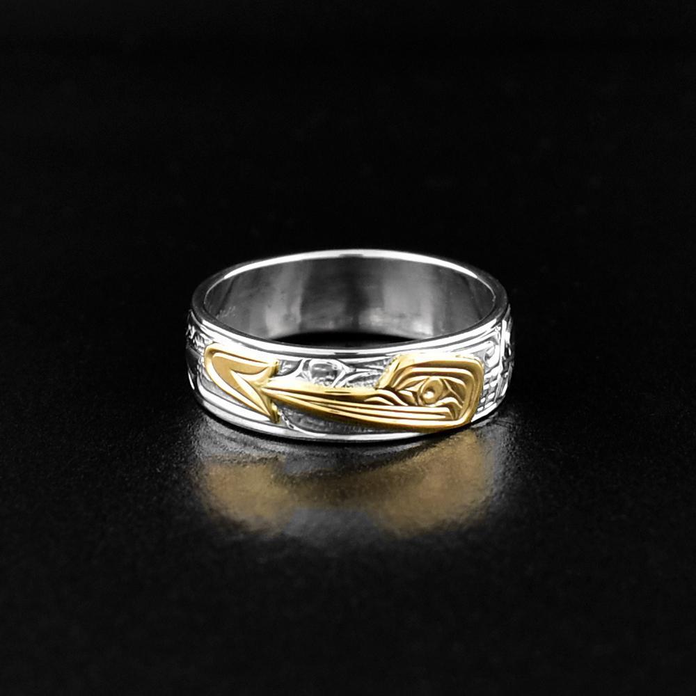 This Hummingbird ring is made from sterling silver and 14K gold. There is a depiction of the Hummingbird carved into the surface of the band and the face of the Hummingbird is made from 14K gold. 