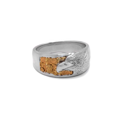 22K Nugget and Sterling Silver Eagle Ring by Tom Gregorczyk. The design depicts an eagle's profile facing the left and 22K gold nuggets behind the eagle's head, creating a 3D effect.