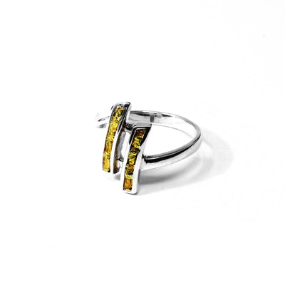 22K Gold Nugget Parallel Ring by Tom Gregorczyk. The front of the ring is shaped like two parallel lines going up with 22k gold nuggets in the center of both. The ring tapers at the back.