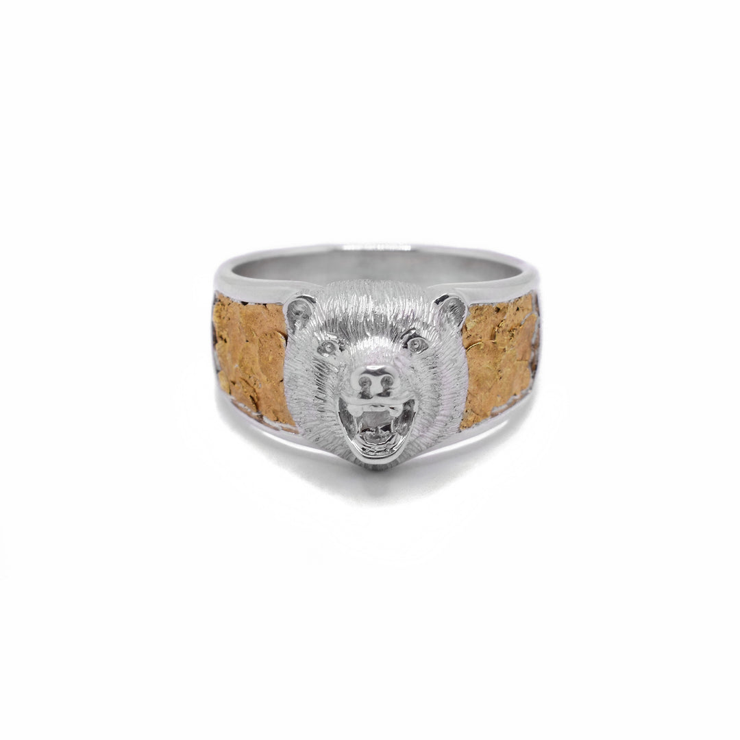 Sterling Silver and 22K Nugget Bear Ring by Tom Gregorczyk. The design depicts the head of a bear with an open mouth extending from the front of the ring with 22K gold nugget on both sides of the bear.