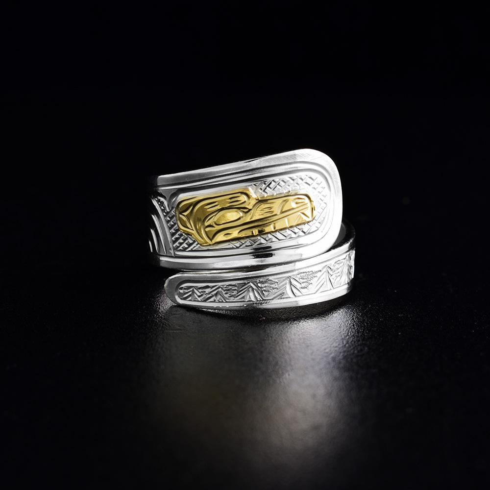 This 14K gold and sterling silver wrap ring has a tapered band that wraps around the finger twice. There is a depiction of the Bear carved into the band and the head of the Bear is made from 14K gold.