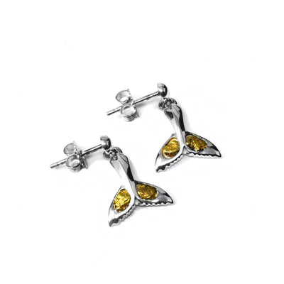 22K Gold Nugget Whale Tail Stud Earrings by Tom Gregorczyk. Each earring is shaped like a whale tail with 22k gold nuggets on both sides of the fin. The rest of the earring is made in sterling silver.