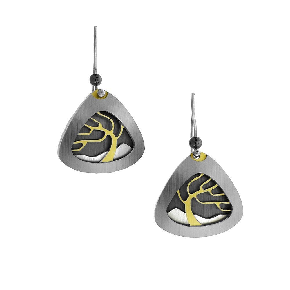 These unique layered earrings are made from brushed aluminum, anodized aluminum and stainless steel. The hangs are teardrop shaped and have depictions of trees in nature.