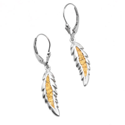 22K Gold Nugget Feather Earrings by Tom Gregorczyk. Each earring is in the shape of a feather with 22k gold nuggets placed in an abstract oval shape in the very center of each earring.