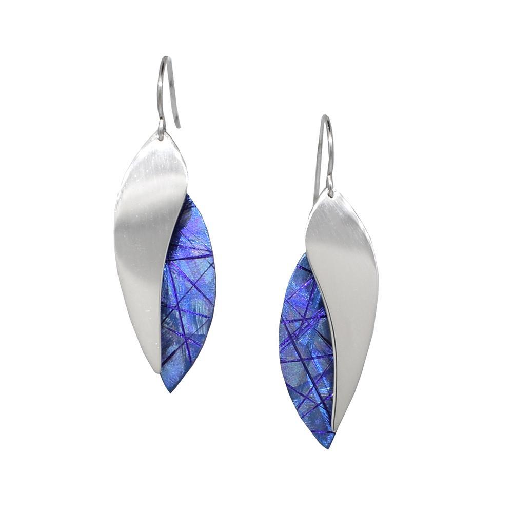 These titanium dangle earrings are made from anodized titanium and sterling silver. The hangs are oval shaped and half of them are blue with colorful designs achieved by anodizing the metal. The other half of the hangs are made from sterling silver.
