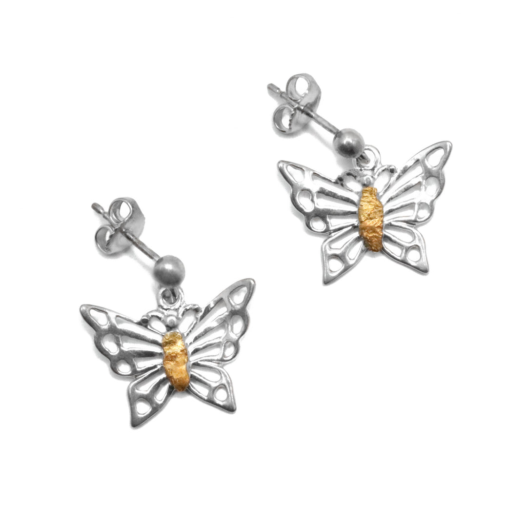 22K Gold Nugget Butterfly Stud Earrings by Tom Gregorczyk. Each earring was handcrafted to resemble a small butterfly with its wings spread out. The areas in which the butterfly has colour on its wings have been cut out. The artist has placed 22k gold nuggets on the butterflies' body in a long, oval shape.