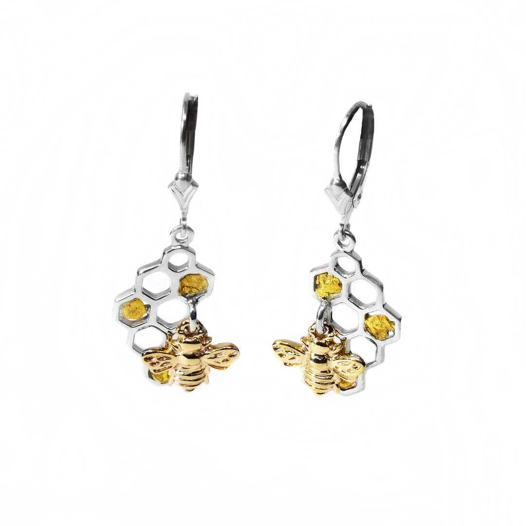 These silver and gold bee earrings depicts a beehive with 22k gold nuggets as honey and small bees attached in the center of each earring.