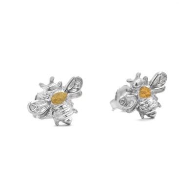 22K Gold Nugget Bee Stud Earrings by Tom Gregorczyk. Each earring has been handcrafted to resemble a small bumblebee with its wings spread out. The artist has placed 22k gold nuggets in the center of each of the bees in a circular shape. The rest of the earring is sterling silver.