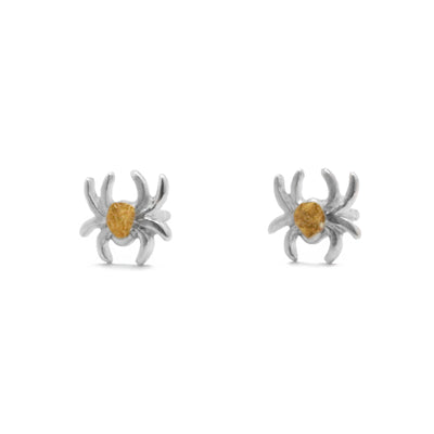 22K Gold Nugget Tiny Spider Stud Earrings by Tom Gregorczyk. Each earring has been handcrafted to replicate a tiny spider with its legs spread out. The artist has added 22k gold nuggets on the entirety of the spider's back in a circular shape. The rest of each earring is sterling silver.