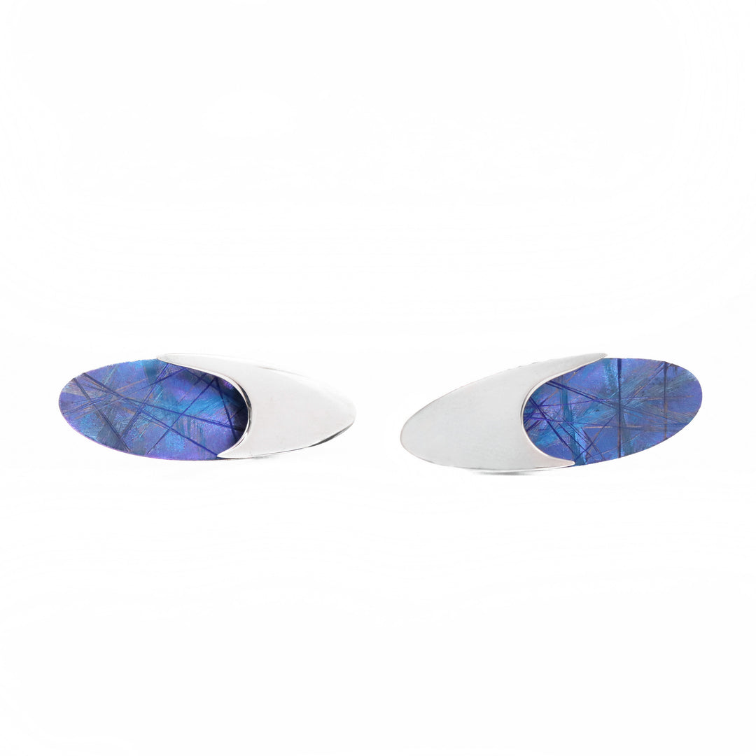 Blue Titanium Oval Stud Earrings are handmade by artist Jean-Yves Nantel.