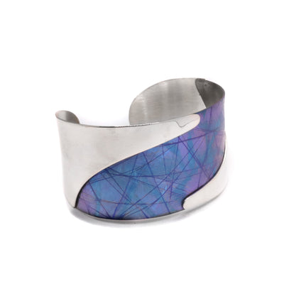 Small Blue Titanium River Bracelet by Jean-Yves Nantel. Anodized blue titanium in the center with sterling silver covering both left and right side of the bracelet.
