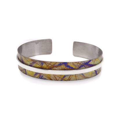 Large Gold Titanium Bracelet by Jean-Yves Nantel. Anodized gold titanium with a sterling silver going down the center of the bracelet.