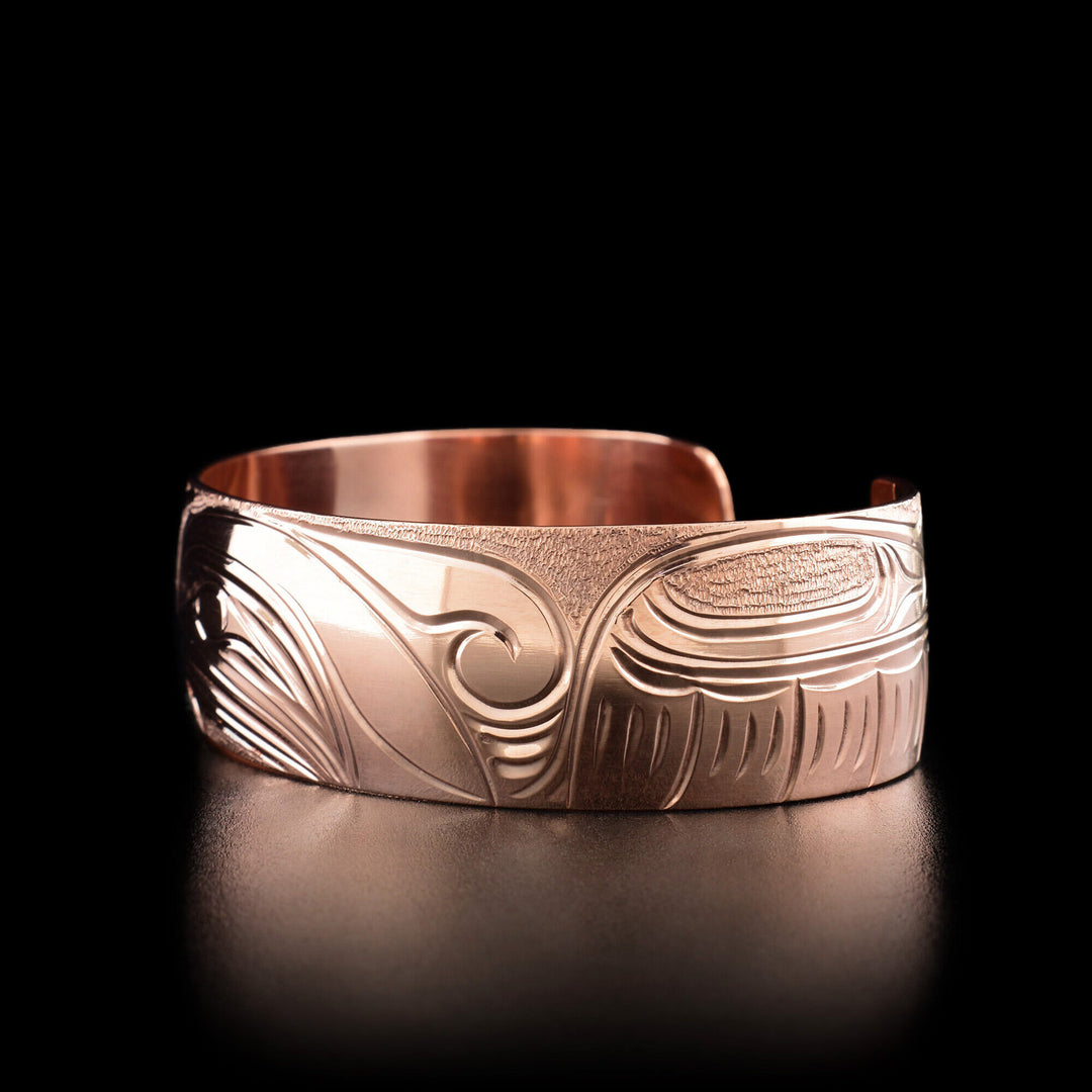 Right angle photo of the bracelet shows the spread out wing of the hummingbird.