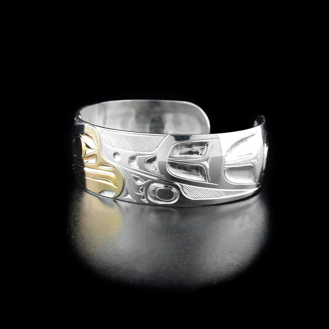 Right angle photo of the bracelet shows carved designs representing the other wing of the eagle and its feathers.