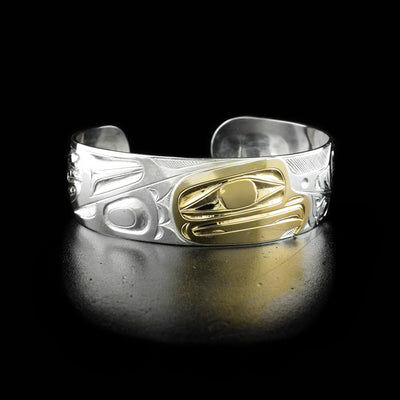 The center of this eagle bracelet is the profile of an eagle's head made from 14k yellow gold facing the right.