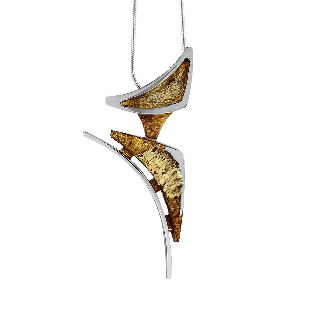 This abstract, oxidized silver pendant has two curved triangle pieces connected together with a sterling silver wire running around it. The triangular pieces are made from oxidized silver and have 10K gold highlights on it.