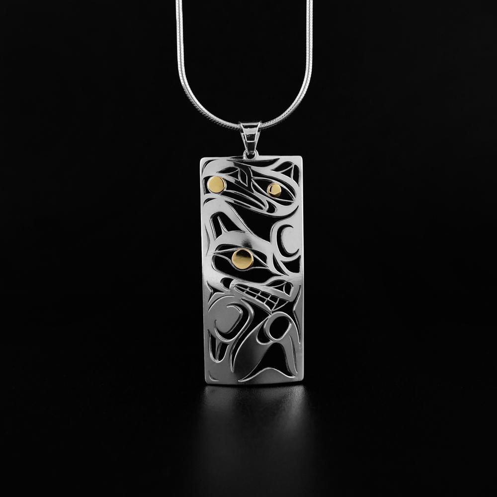 This Raven and Wolf pendant is made from sterling silver and 18K gold with a rectangle shaped. There are cutout depictions of the Raven and the Wolf made in the pendant and the eyes of the Legends are made with 18K gold.
