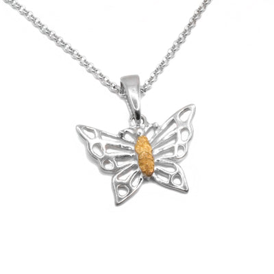 22K Gold Nugget Butterfly Pendant by Tom Gregorczyk. The pendant is in the shape of a butterfly with its wing spread out. The artist has put a 22k gold nugget in the body of the butterfly. The rest of the piece has been made using sterling silver.