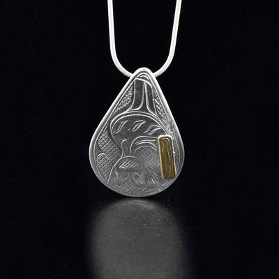  14k gold and sterling silver teardrop orca pendant is hand carved by Victoria Harper.
