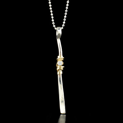 Twig Drop Necklace with Cubic Zirconia handcrafted by artist Joy Annett using sterling silver, 14k gold-filled accent, and cubic zirconia.