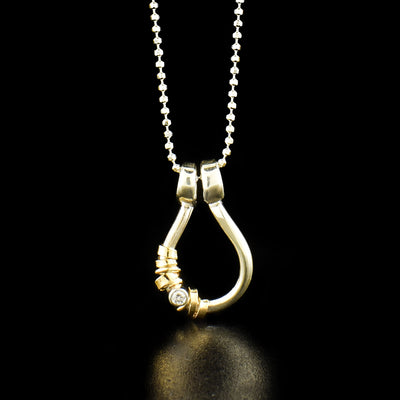 Gold Filled Tear Shaped Necklace with Cubic Zirconia handcrafted by Joy Annett using sterling silver, 14k gold-filled accents, and cubic zirconia.