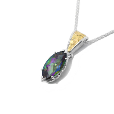 This topaz pendant is marquise-cut and has the colours blue, purple, green, and red. The topaz is held in place by a sterling silver claw setting. The attached bail has 22k yellow gold nuggets on the front.