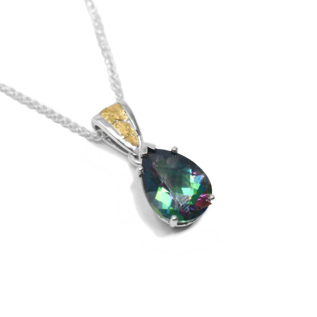 This blue topaz gold pendant is pear shaped and includes the colours pink, green, light blue, and purple. The topaz is held in place by a sterling silver claw setting. The attached bail has 22k yellow gold nuggets on the front.