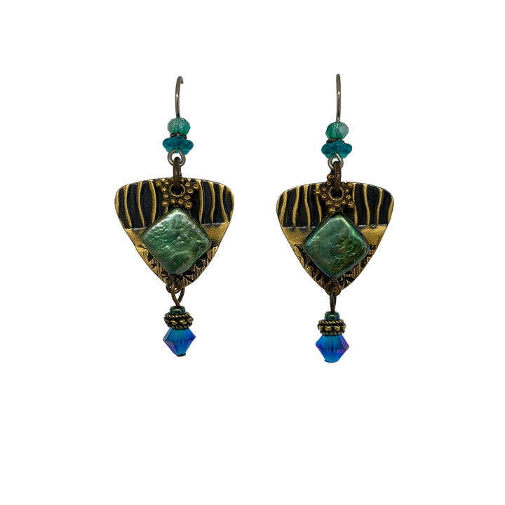 These unique dangling pearl and crystal earrings are made from Swarovski Crystal, Hand worked Brass, Freshwater Pearls, and Pressed Glass. There are brass, triangle hangs with a gemstone in the center and has many small bead of various materials. The beads dangle below it and on the hooks.