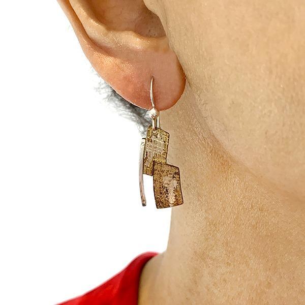 Second photo shows the earrings being worn.