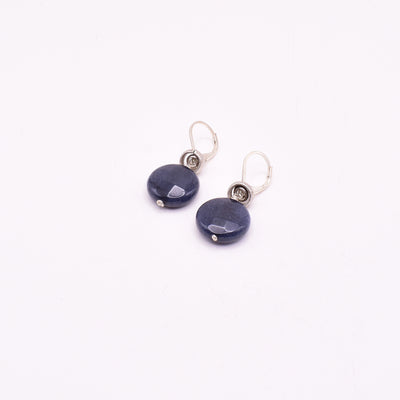 Blue jade coin lever back earrings handcrafted by artist Karley Smith. Made of sterling silver, antique silver and blue jade. Each earring measures 1.2" x 0.6" including hook.