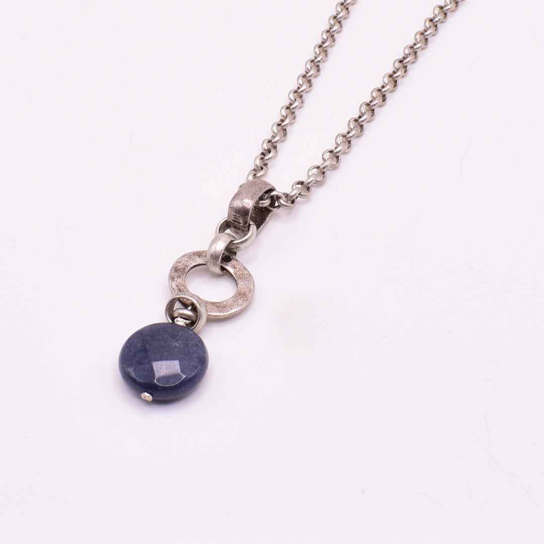 Blue jade pendant necklace handcrafted by artist Karley Smith. Made of blue jade and antique silver. Necklace is 24" long and pendant measures 2" x 0.6" including bail.