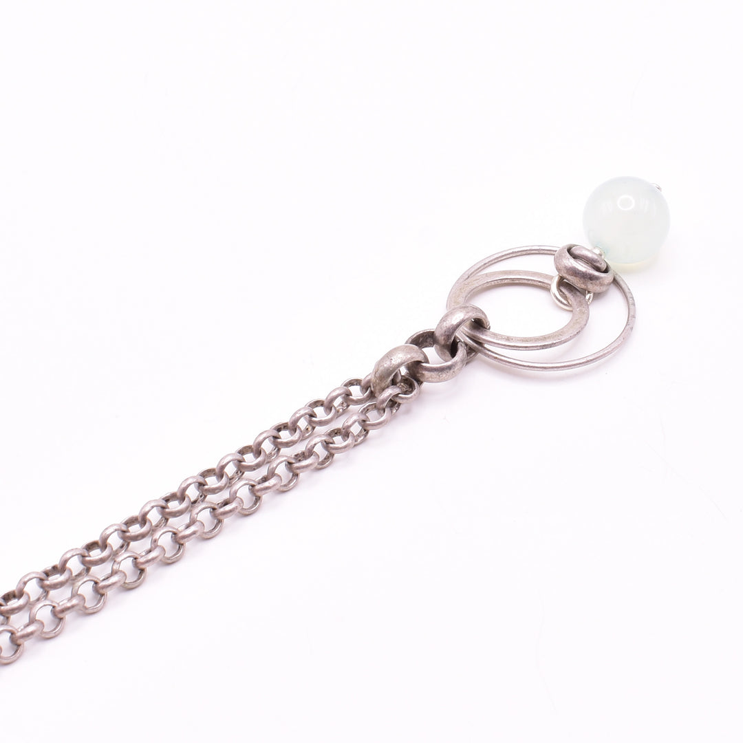 Antique Silver Chalcedony Pendant Necklace handcrafted by artist Karley Smith. Pendant made of sterling silver, antique silver and chalcedony. Antique silver rolo chain included. Pendant measures 1.75" x 0.80" including bail and chain is 24" long.