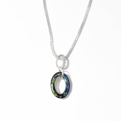 Dazzling pendant handcrafted by artist Debra Nelson. Made of Swarovski crystal, sterling silver and cubic zirconia. Pendant measures 1.10" x 0.44" including bail. Chain not included.
